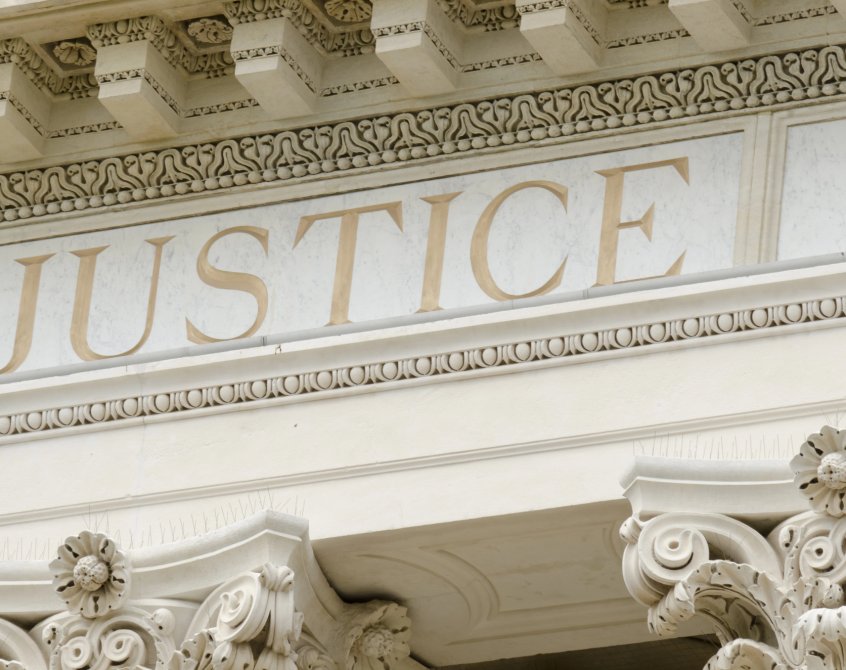 Justice word engraved on court building